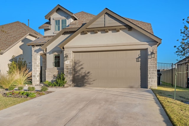 view of front of house with concrete driveway, stone siding, stucco siding, and a garage
