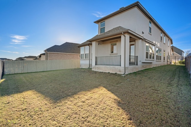 117 Dycus Bnd, Liberty Hill, TX 78642 - rear view of house with stucco siding