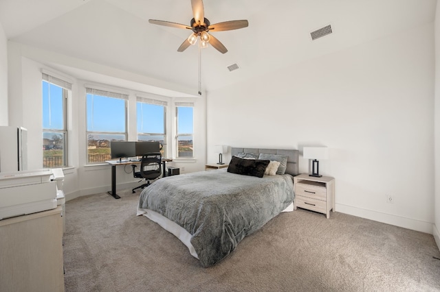 bedroom featuring light colored carpet, visible vents, and vaulted ceiling