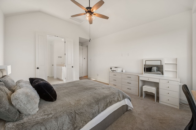 carpeted bedroom featuring ceiling fan, connected bathroom, and lofted ceiling