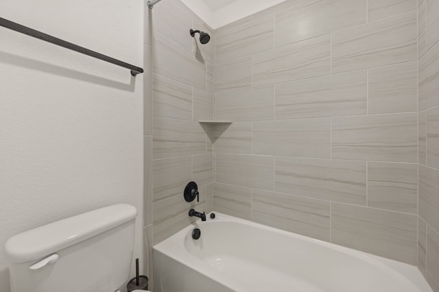 bathroom with toilet and washtub / shower combination