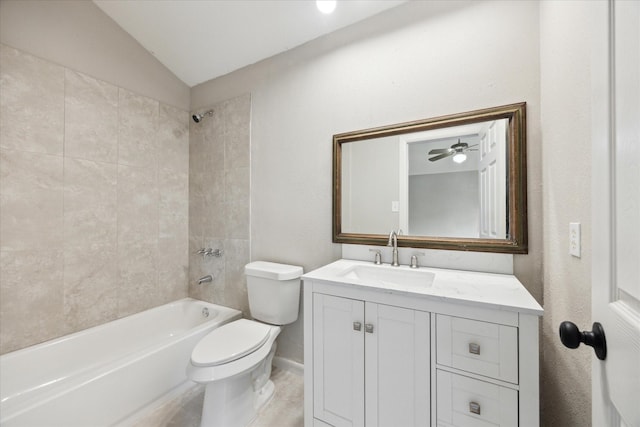 full bathroom featuring lofted ceiling, tiled shower / bath, vanity, toilet, and ceiling fan