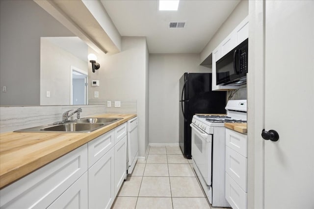 5300 Mccandless St, Austin, TX 78756 - kitchen with white appliances, white cabinets, light tile patterned flooring, and wood counters