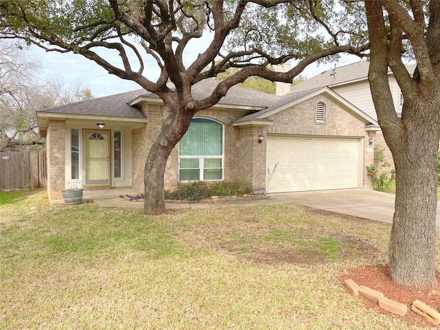 ranch-style house with a front yard and a garage