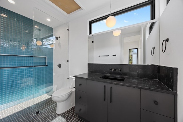 bathroom with walk in shower, vanity, tile patterned floors, and toilet