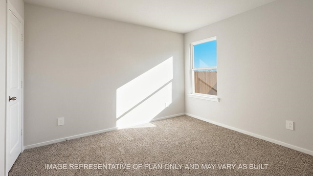 empty room featuring carpet flooring