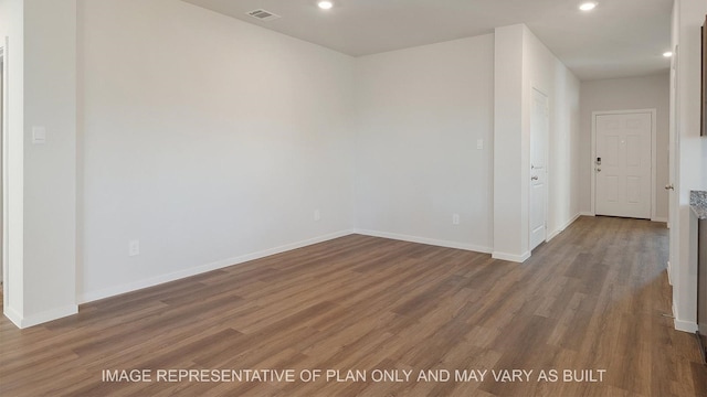 empty room featuring dark hardwood / wood-style flooring