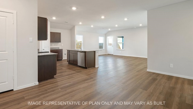 kitchen with an island with sink, dark hardwood / wood-style floors, dark brown cabinets, dishwasher, and sink