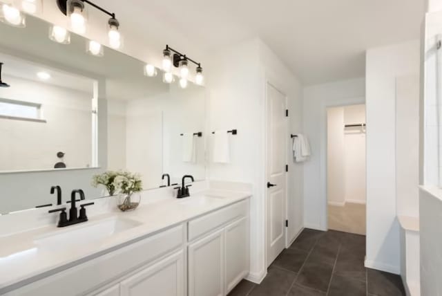 bathroom with tile patterned floors and vanity