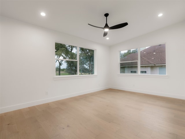 unfurnished room with ceiling fan and light hardwood / wood-style flooring