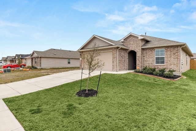 228 Rough Hollow Cv, San Marcos, TX 78666 - ranch-style home featuring brick siding, concrete driveway, an attached garage, and a front yard