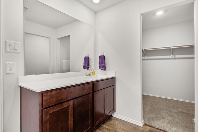 bathroom with wood-type flooring and vanity