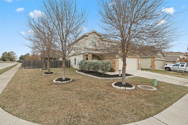 view of front of home with a front lawn and a garage