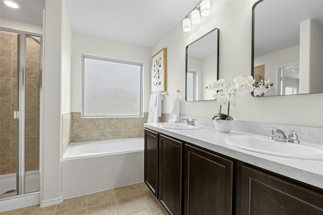 bathroom with separate shower and tub, vanity, and tile patterned flooring