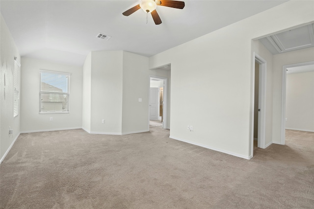 unfurnished room featuring ceiling fan, light colored carpet, and lofted ceiling