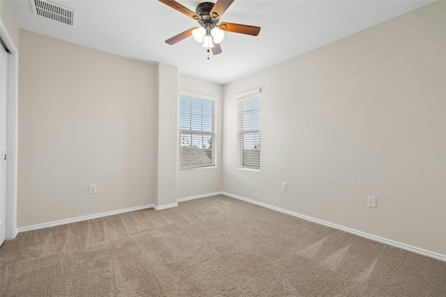 carpeted empty room with ceiling fan