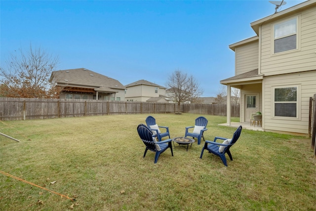 view of yard with an outdoor fire pit and a patio