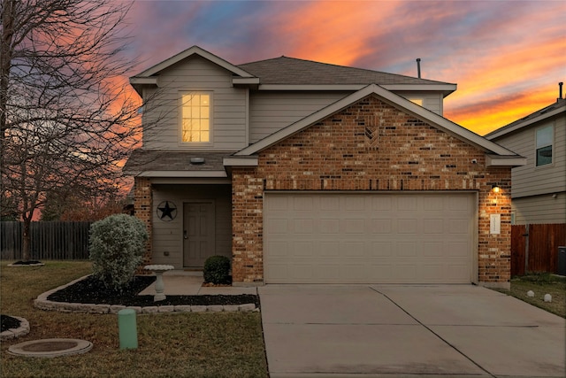 front of property with a garage