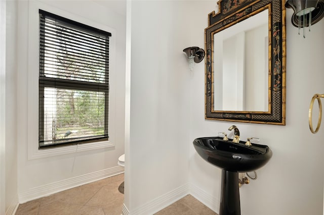 bathroom featuring toilet and tile patterned floors