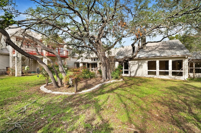 view of yard featuring a sunroom