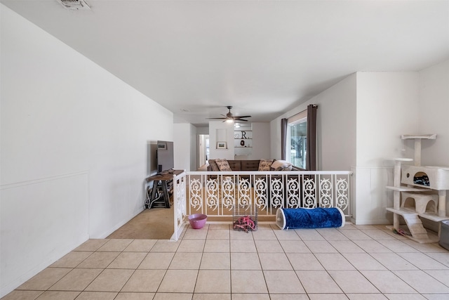 hall with light tile patterned floors