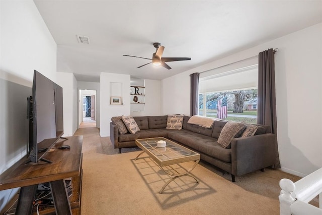 504 Marburger St, Smithville, TX 78957 - living room featuring light carpet and a ceiling fan