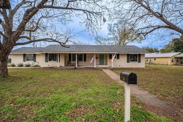 single story home featuring a front yard and a porch