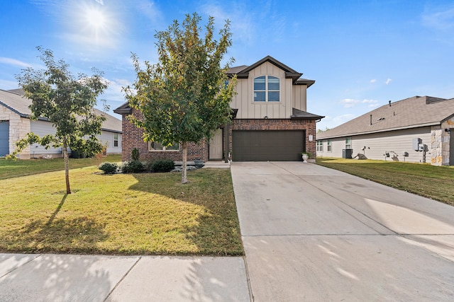 view of front of property featuring a front yard and a garage