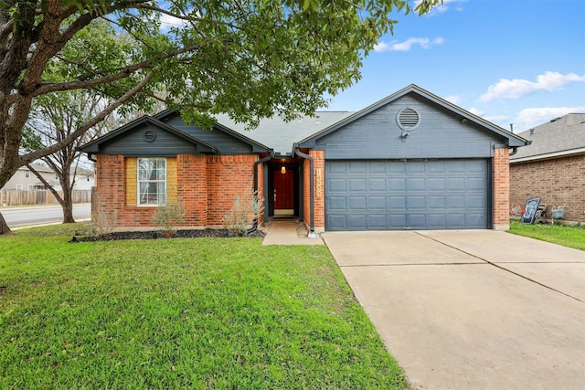 ranch-style house featuring a front lawn and a garage