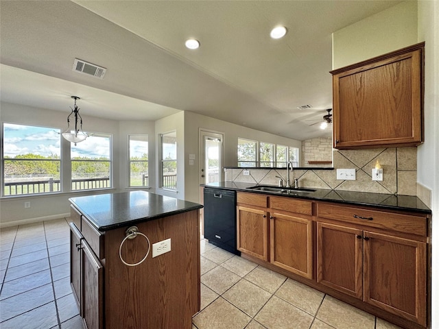 kitchen featuring sink, a center island, dishwasher, decorative backsplash, and hanging light fixtures