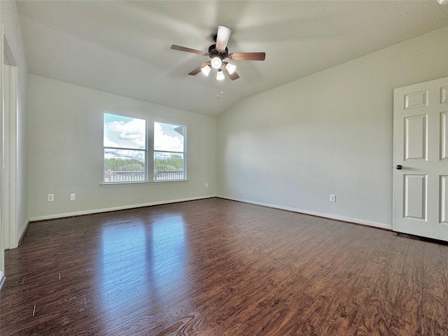 spare room with ceiling fan, dark hardwood / wood-style flooring, and vaulted ceiling