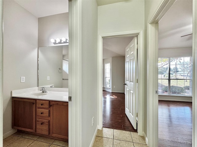 bathroom with tile patterned floors and vanity