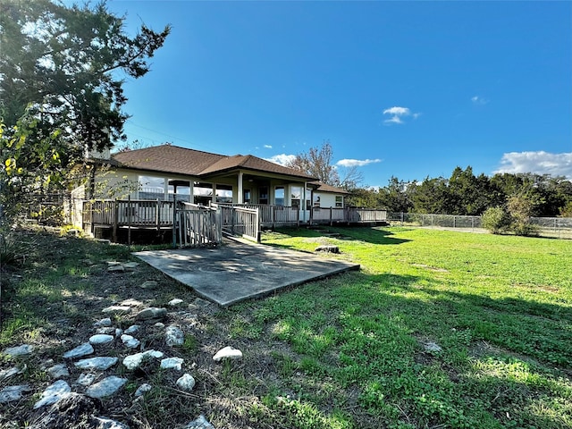 view of yard featuring a patio and a deck