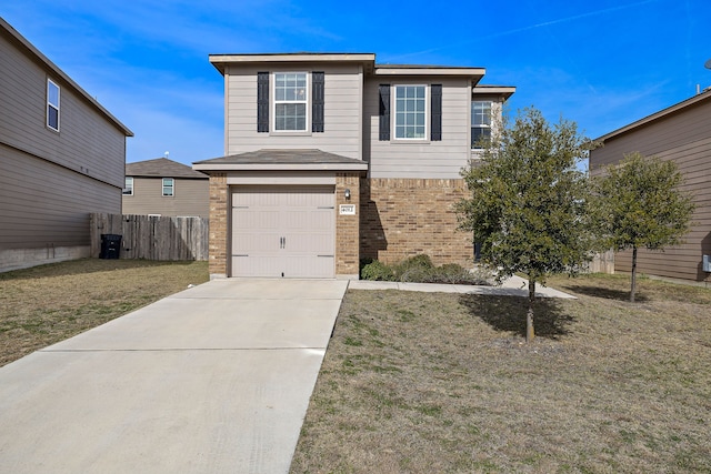 view of property featuring a garage and a front lawn