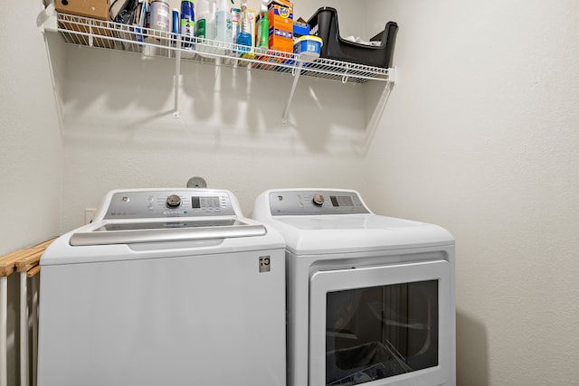 washroom with washer and dryer