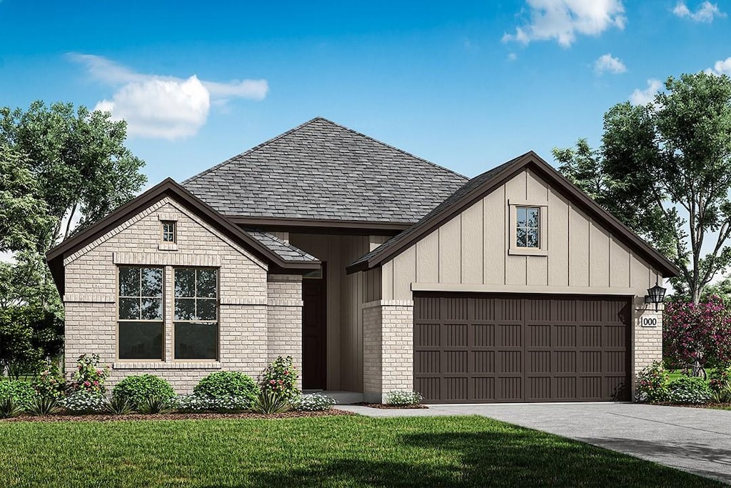 modern farmhouse style home with a front yard and a garage