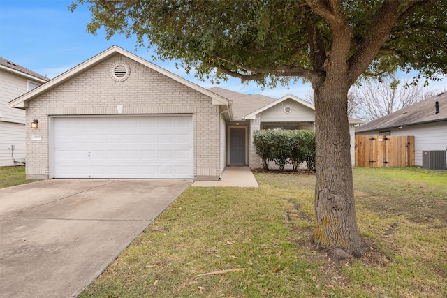 ranch-style home with central AC unit, a front yard, and a garage