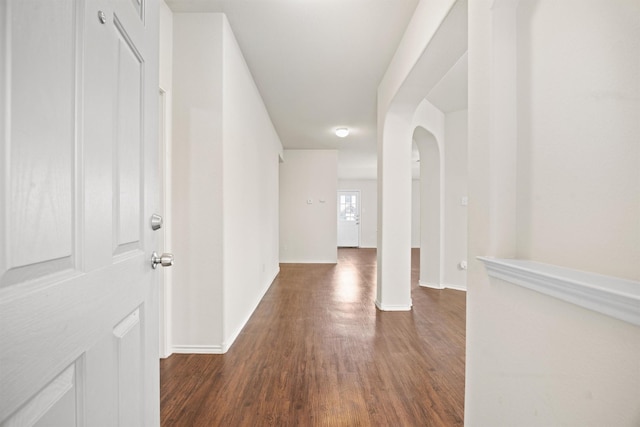 hallway featuring dark hardwood / wood-style floors