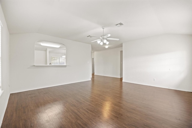 unfurnished room featuring lofted ceiling, ceiling fan, and dark wood-type flooring