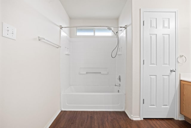 bathroom with hardwood / wood-style flooring, shower / bathing tub combination, and vanity