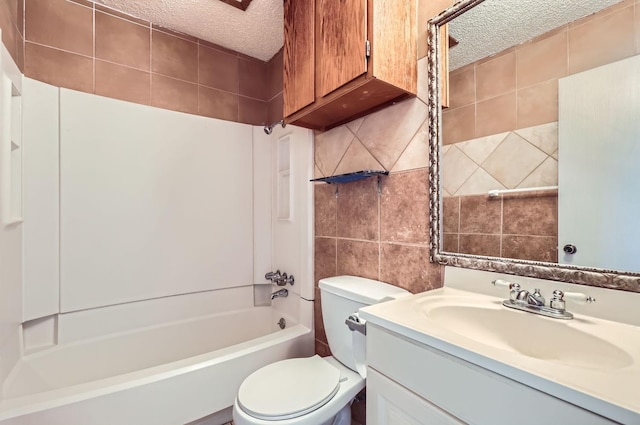 full bathroom with a textured ceiling, tasteful backsplash, toilet, shower / bath combination, and vanity