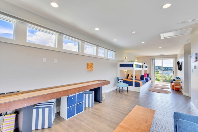 game room with wood-type flooring