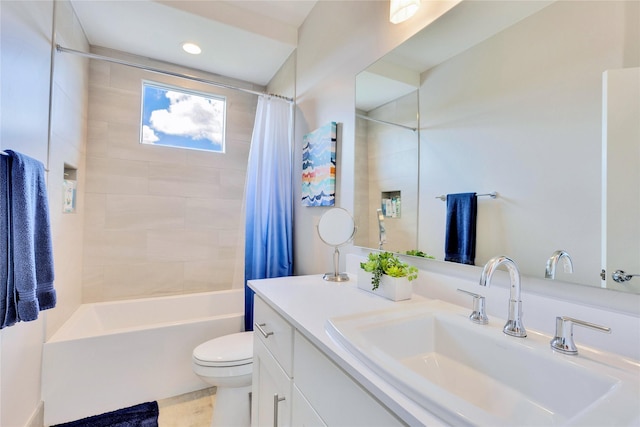 full bathroom with toilet, shower / bath combination with curtain, and vanity