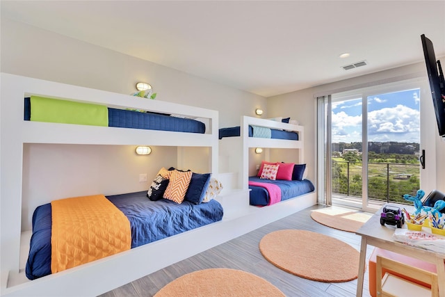 bedroom with wood-type flooring