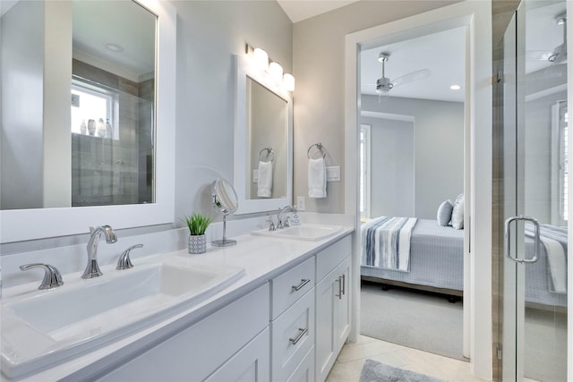 bathroom featuring vanity, tile patterned flooring, ceiling fan, and walk in shower