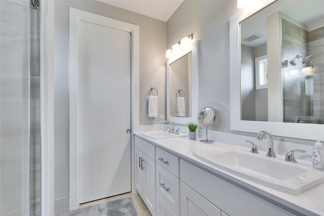 bathroom with a shower and vanity