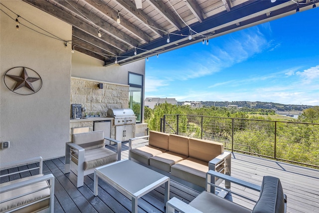 deck featuring a grill and outdoor lounge area