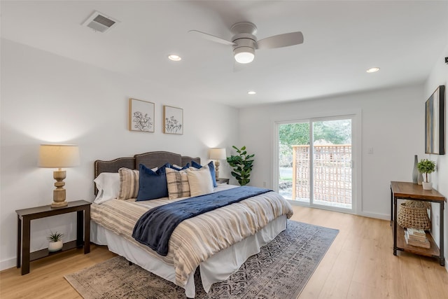 bedroom featuring ceiling fan, light hardwood / wood-style floors, and access to outside