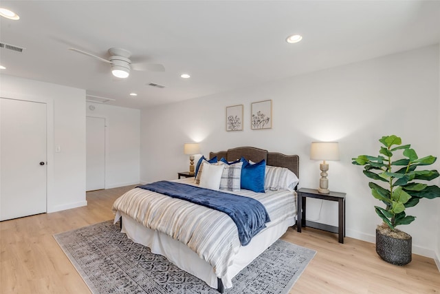 bedroom featuring ceiling fan and light hardwood / wood-style flooring