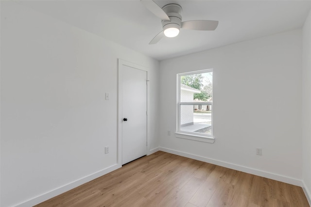 spare room featuring ceiling fan and light hardwood / wood-style flooring